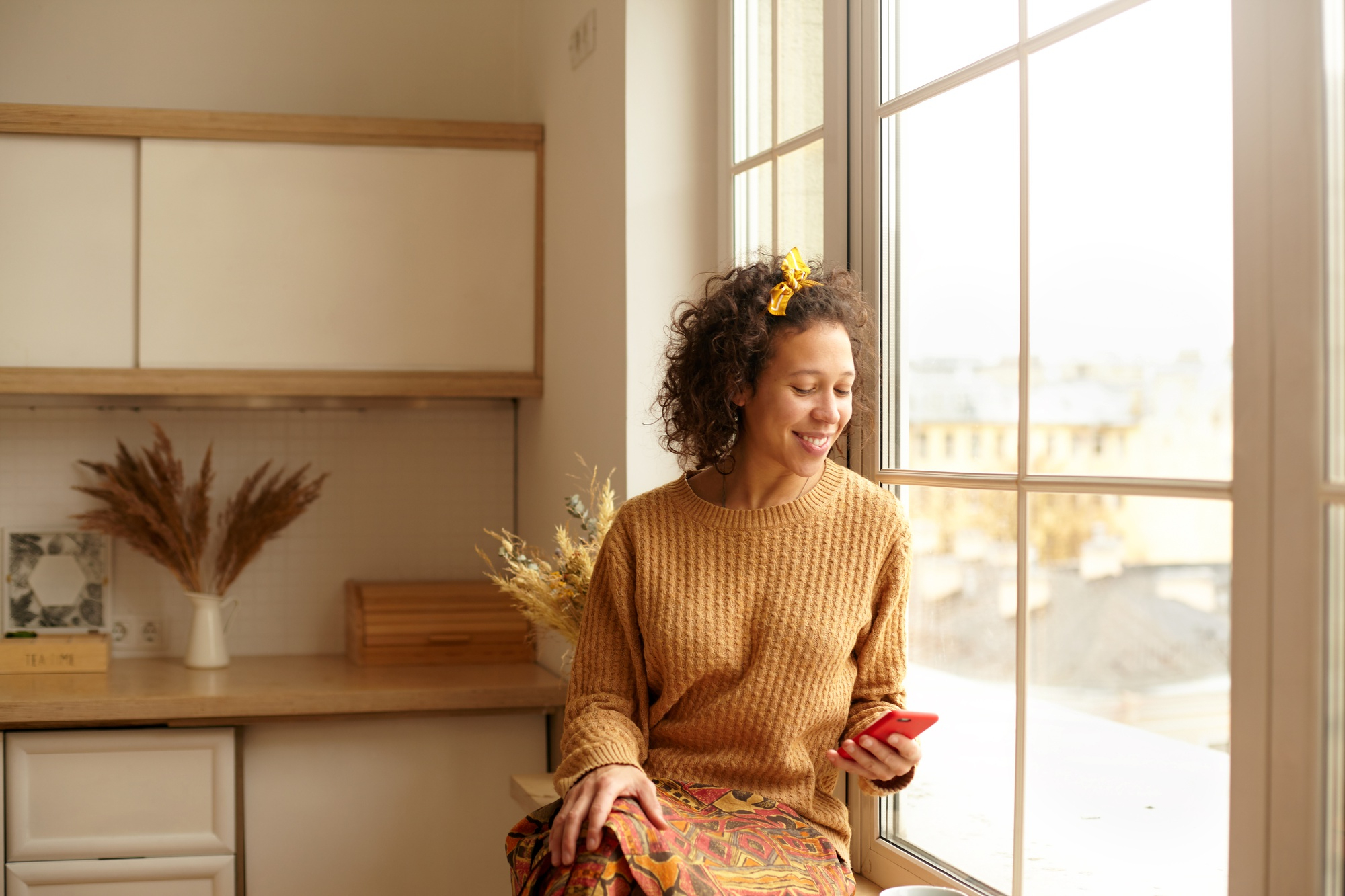 Young Asian woman smiling in sunshine feeling free through teletherapy at Advanced Client Care